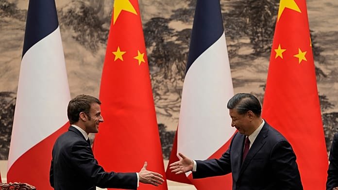 Macron llama a "superar" los desacuerdos con China desde Pekín
