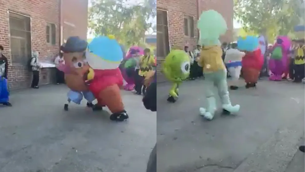 Personajes infantiles a las piñas en un acto escolar