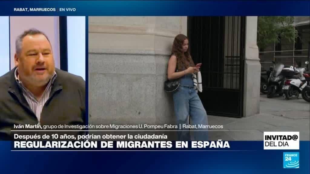 ¿Qué factores impulsaron la regularización de 500.000 migrantes en España?